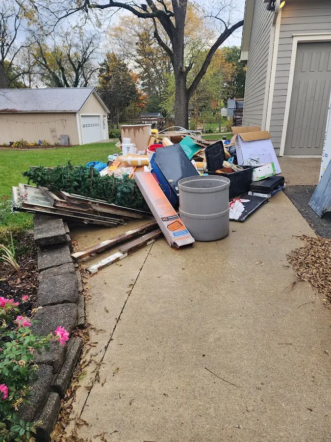 Dumpster being loaded with debris for Demolition Dumpster Rental in Blairsville